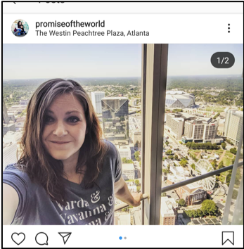 Instagram screenshot of Laura (author) in front of a window showing the Atlanta skyline from the Westin Peachtree Plaza.